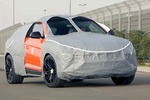 Прототип Lamborghini Urus PHEV замечен в самом странном камуфляже